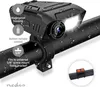 A black digital camera with a light is mounted on a bicycle handlebar. Water droplets are visible on the camera and handlebar, suggesting it is waterproof. Produktbild-Vorschau