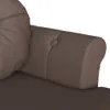 A close-up view of a brown tufted sofa armrest and cushion. Náhľad obrázku produktu