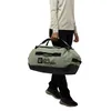 A person is holding a duffel bag. Produktbild-Vorschau
