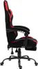 A side view of a black and red gaming chair with a footrest extended. Produktbild-Vorschau