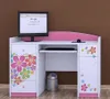 A child's computer desk with a monitor, keyboard, and drawers decorated with colorful flowers. Produktbild-Vorschau