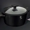 A black cooking pot with a glass lid is shown against a dark background. Podgląd zdjęcia produktu