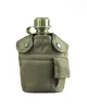 A military-style water bottle with a fabric cover and a small pouch. Podgląd zdjęcia produktu