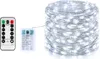 A string of white LED lights on a silver wire, next to a remote control and a battery pack. Produktbild-Vorschau