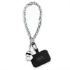 A silver chain with a black universal hand strap and a small white cat charm with sunglasses. Anteprima dell’immagine prodotto