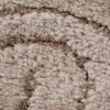 A close-up view of a textured rug with a marbled pattern. Anteprima dell’immagine prodotto