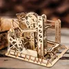 A wooden mechanical marble run model on a wooden surface. Produktbild-Vorschau