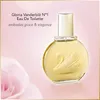A bottle of Gloria Vanderbilt No. 1 Eau De Toilette is shown against a soft pink background with a blurred pink rose in the foreground. Náhľad obrázku produktu