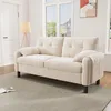 A beige sofa is shown in a well-lit room with a door and windows in the background. Náhľad obrázku produktu