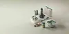 A collection of kitchen gadgets arranged on a light gray surface. Anteprima dell’immagine prodotto