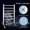 A promotional image for an electric towel warmer, showing the product and highlighting its features with text and diagrams. Produktbild-Vorschau