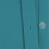 A close-up view of a teal-colored fabric with a button and buttonhole. Anteprima dell’immagine prodotto