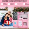 A family posing in front of a Christmas tree with a pink toy kitchen. Produktbild-Vorschau