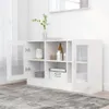 A white cabinet with glass doors and shelves is displayed in a room with a gray rug and white walls. Produktbild-Vorschau
