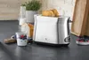 A toaster with bread, yogurt, and berries on a kitchen counter. Produktbild-Vorschau