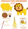 A flat lay image displaying the components and finished product of a lion sewing kit. Produktbild-Vorschau