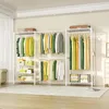 A clothing rack filled with colorful clothes and storage bins. Podgląd zdjęcia produktu