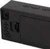 A close-up view of the side and top of a black digital alarm clock. Voir les images du produit