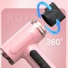 Close-up of a pink hairdryer with a black nozzle attachment being demonstrated. Produktbild-Vorschau