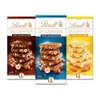 Three Lindt Les Grandes chocolate bars with hazelnuts and almonds, presented in their packaging. Produktbild-Vorschau
