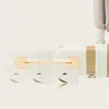 Close-up of adjustable parts of a baby bed/crib, showing a sliding mechanism with arrows indicating movement. Produktbild-Vorschau