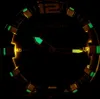 A close-up of a watch face in the dark, with luminous markers and hands. Podgląd zdjęcia produktu