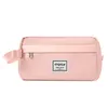 A pink cosmetic bag with a handle and a zipper, placed on a white background. Náhľad obrázku produktu