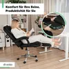 A woman is sitting in a black office chair with her legs extended on a footrest, reading a book. The scene is set in a home office or living room environment. Produktbild-Vorschau