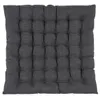 A square seat cushion with a tufted pattern. Produktbild-Vorschau