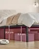 The underside of a bed frame with storage boxes and measurements indicated. Produktbild-Vorschau