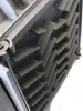 A close-up view of the intricate metal fins of a fireplace insert. Produktbild-Vorschau