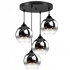 A multi-pendant light fixture with four glass shades. Podgląd zdjęcia produktu
