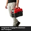 A person is carrying a red and black wet/dry vacuum cleaner. Produktbild-Vorschau