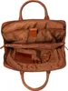 The interior of an open brown leather business bag. Produktbild-Vorschau