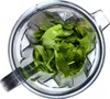 A top-down view of fresh spinach leaves inside a blender jar. Podgląd zdjęcia produktu