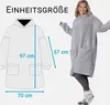 A woman wearing a grey hoodie blanket is shown next to a diagram of the hoodie blanket with measurements. Produktbild-Vorschau