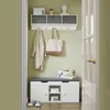 A hallway with a shoe bench, coat rack, and storage shelves. Produktbild-Vorschau