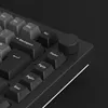 A close-up shot of a black mechanical keyboard with a rotary knob. Produktbild-Vorschau