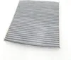 A close-up, top-down view of a gray, pleated air filter on a white background. Anteprima dell’immagine prodotto