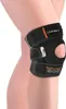 A person's leg wearing a black knee brace. Náhled obrázku produktu