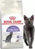 A bag of Royal Canin Sterilised cat food is shown next to a gray cat. Náhled obrázku produktu