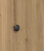 A close-up view of a dark knob on a wooden surface. Podgląd zdjęcia produktu