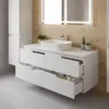 A modern bathroom vanity with a sink and drawers, set against a wood-paneled wall. Produktbild-Vorschau