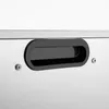 A close-up view of a black handle on a silver appliance. Podgląd zdjęcia produktu