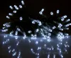 A close-up shot of a string of white LED lights against a dark background, with reflections on a shiny surface. Produktbild-Vorschau