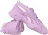 A pair of purple Reebok sneakers are shown against a white background. Náhled obrázku produktu