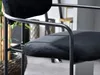 Close-up of a black bar stool with a metal frame. Produktbild-Vorschau