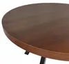 A close-up view of a round wooden table with black legs. Náhled obrázku produktu