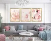 A living room scene with a sofa, coffee table, and artwork on the wall. Voir les images du produit