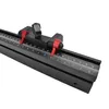 A close-up shot of a black woodworking miter track fence with red adjustment knobs and a measuring scale. Podgląd zdjęcia produktu